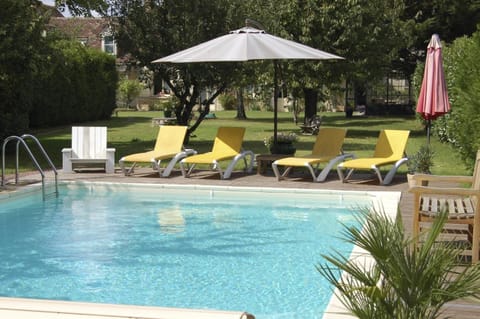 Seasonal outdoor pool, a heated pool, pool umbrellas, sun loungers
