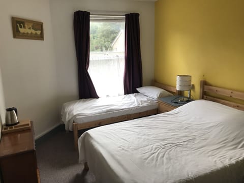 Family Triple Room | Blackout drapes, iron/ironing board, free WiFi, bed sheets