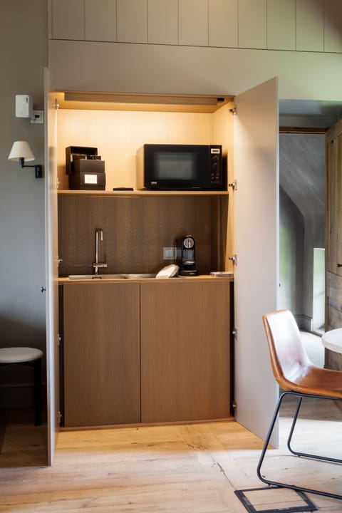 Suite, 1 King Bed | In-room safe, blackout drapes, soundproofing, iron/ironing board