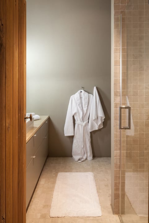 Suite, 1 King Bed | Bathroom | Shower, rainfall showerhead, free toiletries, hair dryer