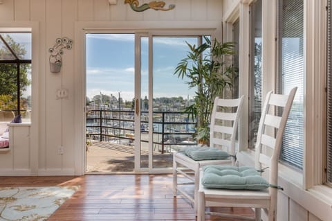 sunroom with entry to harbor view deck