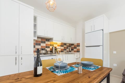 Apartment | Private kitchenette | Full-size fridge, microwave, stovetop, dishwasher