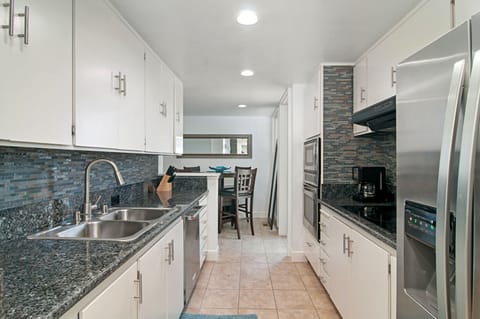 kitchen with closet washer and dryer and dinette for 4