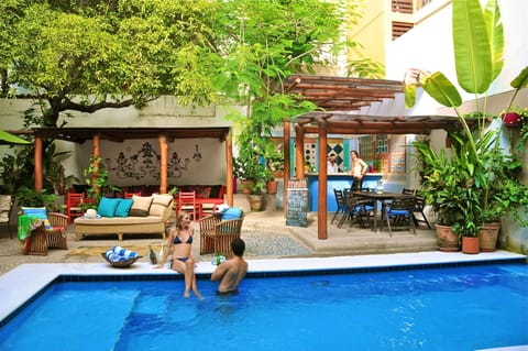 Outdoor pool, open 9:00 AM to 11:00 PM, pool umbrellas