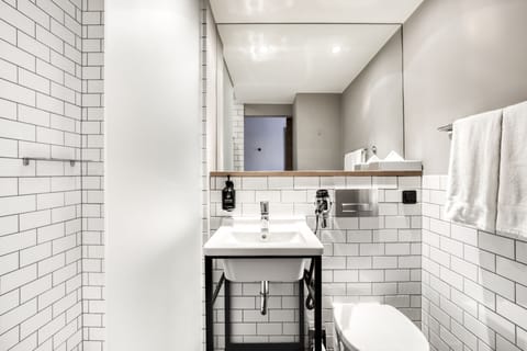 Shower, rainfall showerhead, designer toiletries, hair dryer