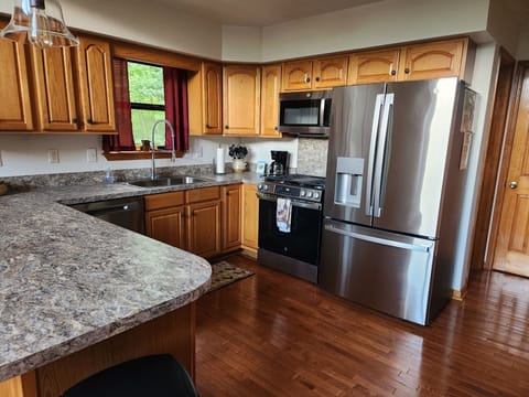 Large, fully equipped kitchen with brand new stainless steel appliances