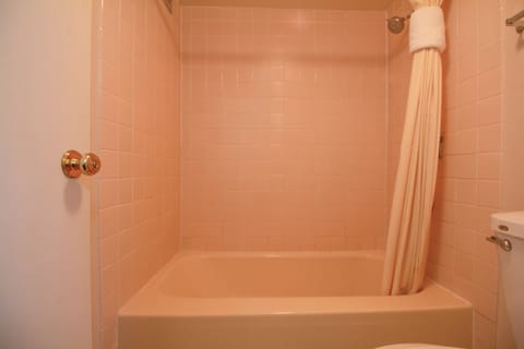 Suite, 1 King Bed | Bathroom | Combined shower/tub, deep soaking tub, free toiletries, hair dryer