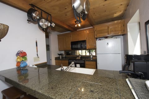 Dining room view into kitchen & into living room
