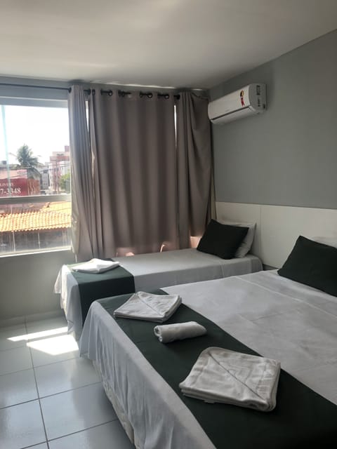 Triple Room, Multiple Beds, Non Smoking | Minibar, free WiFi, bed sheets