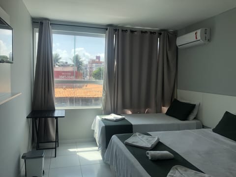 Triple Room, Multiple Beds, Non Smoking | Minibar, free WiFi, bed sheets