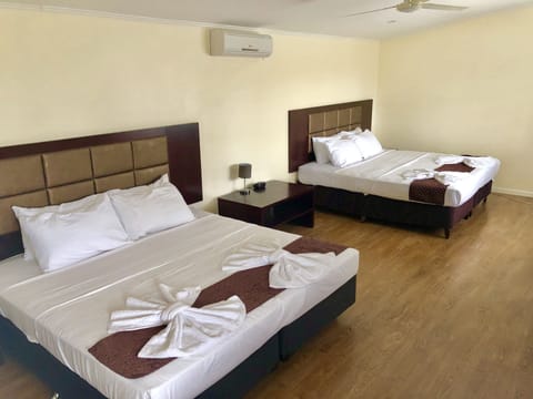 Standard Quadruple Room, Multiple Beds | Blackout drapes, bed sheets
