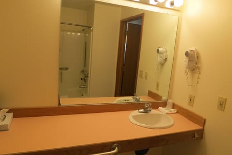 Suite, 1 King Bed, Jetted Tub (Jacuzzi Suite) | Bathroom | Hair dryer, towels