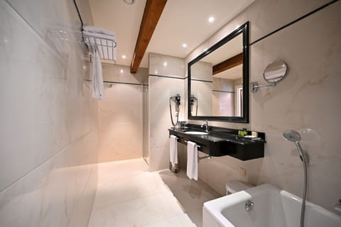 The King Loft | Bathroom | Separate tub and shower, designer toiletries, hair dryer, towels