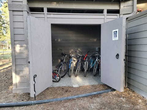 12 adult bikes, 2 junior bikes and a tricycle locker