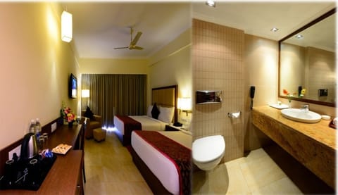 Executive Room, 2 Double Beds | Bathroom | Rainfall showerhead, free toiletries, hair dryer, towels