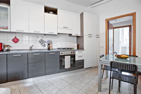 Apartment, 1 Bedroom | Private kitchen | Full-size fridge, stovetop, cookware/dishes/utensils