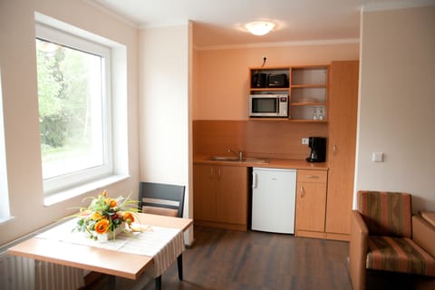 Twin Room | Private kitchen | Fridge, microwave, coffee/tea maker, electric kettle