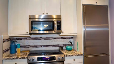 Sub-zero refrigerator and Kitchen Aid stove & microwave