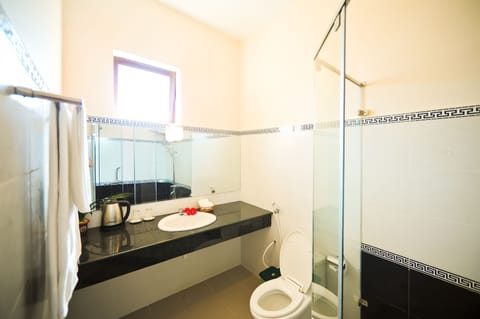 Suite, 1 King Bed, Garden View | Bathroom shower