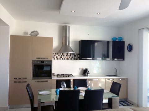 Apartment (3 Bedrooms) | Private kitchen | Full-size fridge, microwave, oven, coffee/tea maker