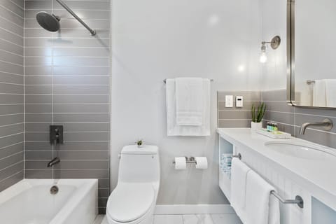 Family Suite | Bathroom | Designer toiletries, hair dryer, bathrobes, slippers