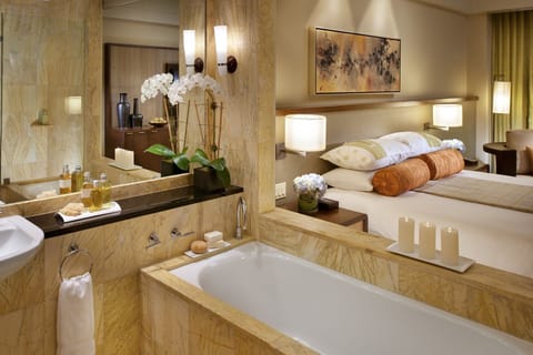 Separate tub and shower, designer toiletries, hair dryer, bathrobes