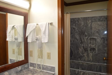 Standard Room, 1 King Bed | Bathroom | Combined shower/tub, hair dryer, towels