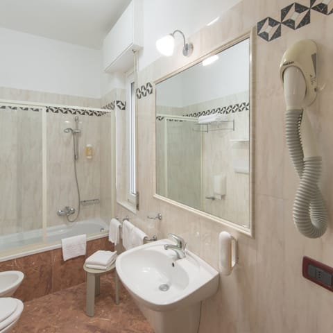 Quadruple Room, 1 Bedroom | Bathroom | Shower, rainfall showerhead, free toiletries, hair dryer