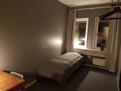 Single Room, Shared Bathroom | Blackout drapes, iron/ironing board, free WiFi, bed sheets