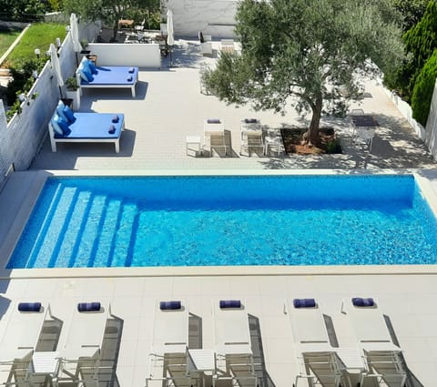 2 outdoor pools, pool umbrellas, sun loungers