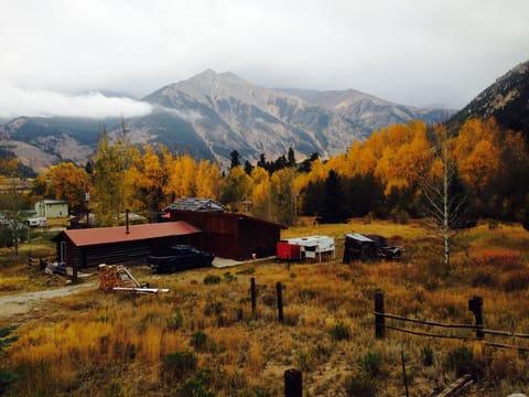 The cabin in the fall, looking down from the road above,
