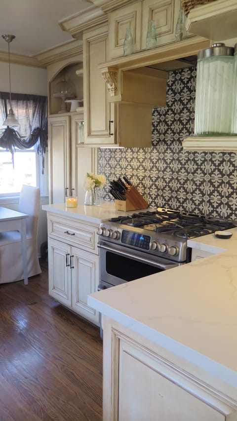 Updated kitchen with quartz countertops and double oven.