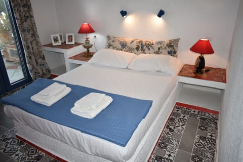 Standard Apartment, Partial Sea View | In-room safe, desk, iron/ironing board, free WiFi