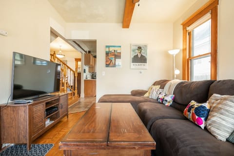 Living Room adjacent master bedroom, stairs to second floor and kitchen