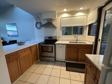 Bright and spacious kitchen, with a back deck.