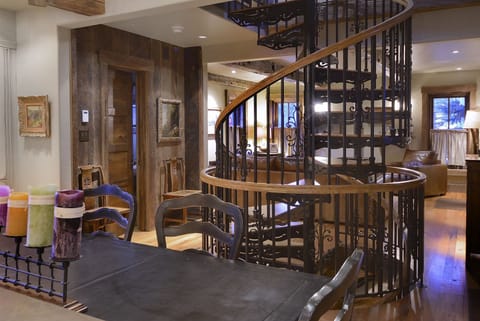 An over-sized spiral staircase anchors the home