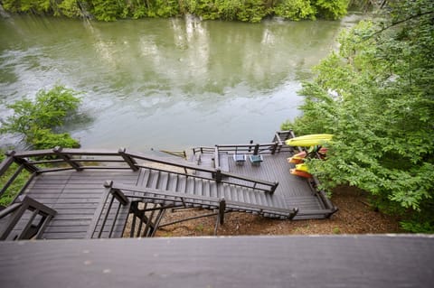 Welcome to Kingfisher with a deck leading the Mountain Fork River!