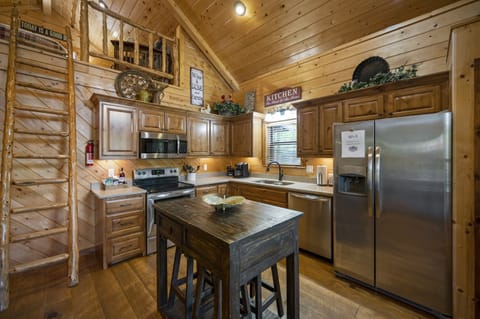 The kitchen may be small, but it has full size appliances and everything you need to cook up great meals!