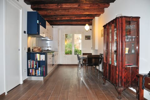 Living-room with furniture, kitchen and window on the garden