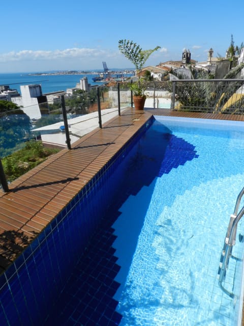 Outdoor pool, open 7:00 AM to 8:00 PM, pool umbrellas, sun loungers