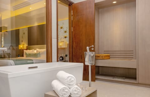 Premium Suite, Multiple Beds, Kitchenette | Bathroom | Shower, rainfall showerhead, designer toiletries, hair dryer