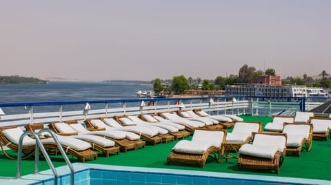 Outdoor pool, open 7:00 AM to 5:00 PM, pool umbrellas, sun loungers