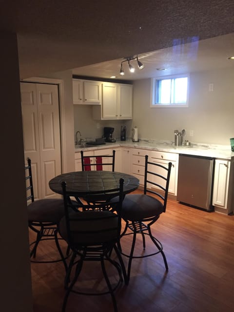 Lower Level Area: Breakfast Nook with Wet Bar, Refrigerator, Sink, Dining Area