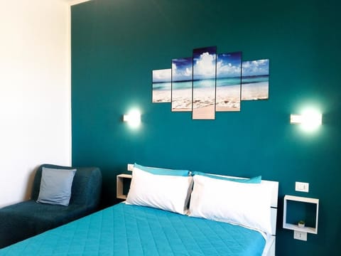 Triple Room, City View | Minibar, desk, blackout drapes, soundproofing