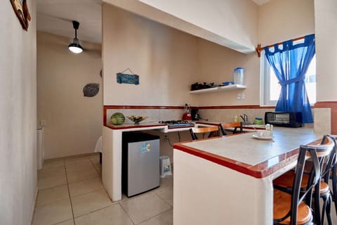 Family Bungalow, Kitchen | Minibar, blackout drapes, iron/ironing board, free wired internet