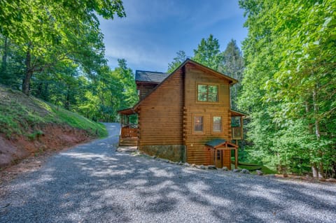 Large 3 story log cabin in the mountains with hot tub and private Lake access.