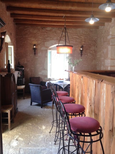 View on the living room with bar and kitchen on the right side
