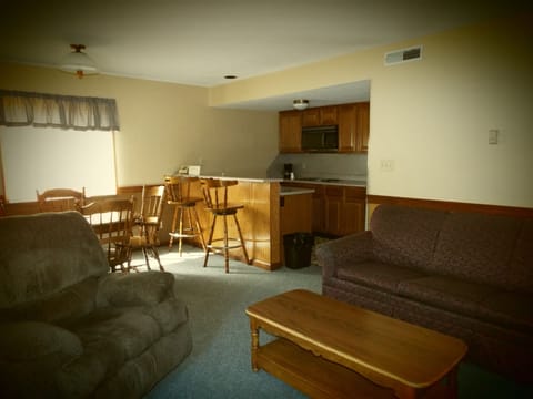 One Bed Suite | Living area | 32-inch flat-screen TV with cable channels, TV