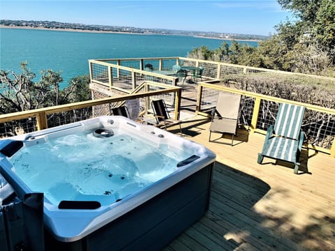 Large deck area for relaxing in the hot tub & enjoying Lake views & sunsets.