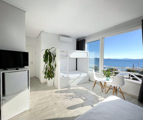 Family Quadruple Room, 1 Bedroom, Sea View | Hypo-allergenic bedding, in-room safe, individually decorated